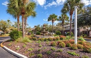 Beautifully landscaped exterior with fountains